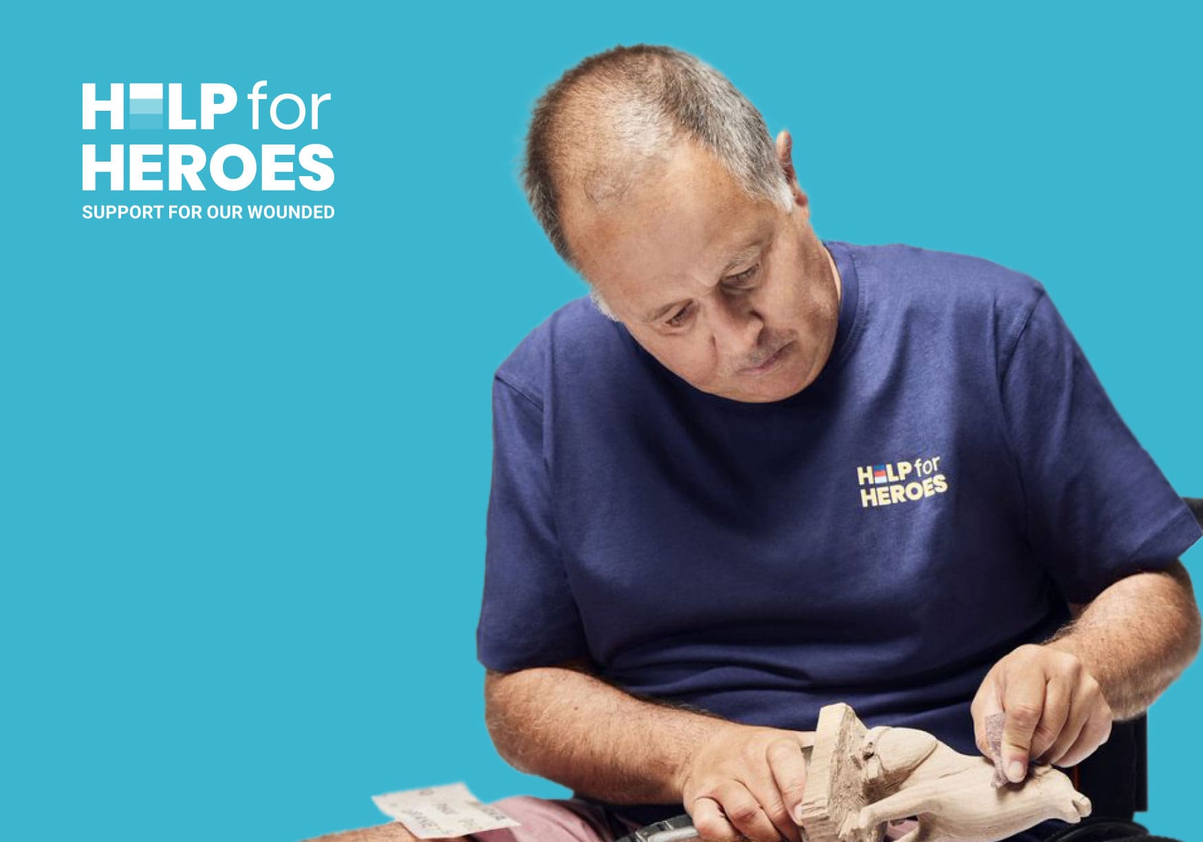 Man sculpting a dog figurine